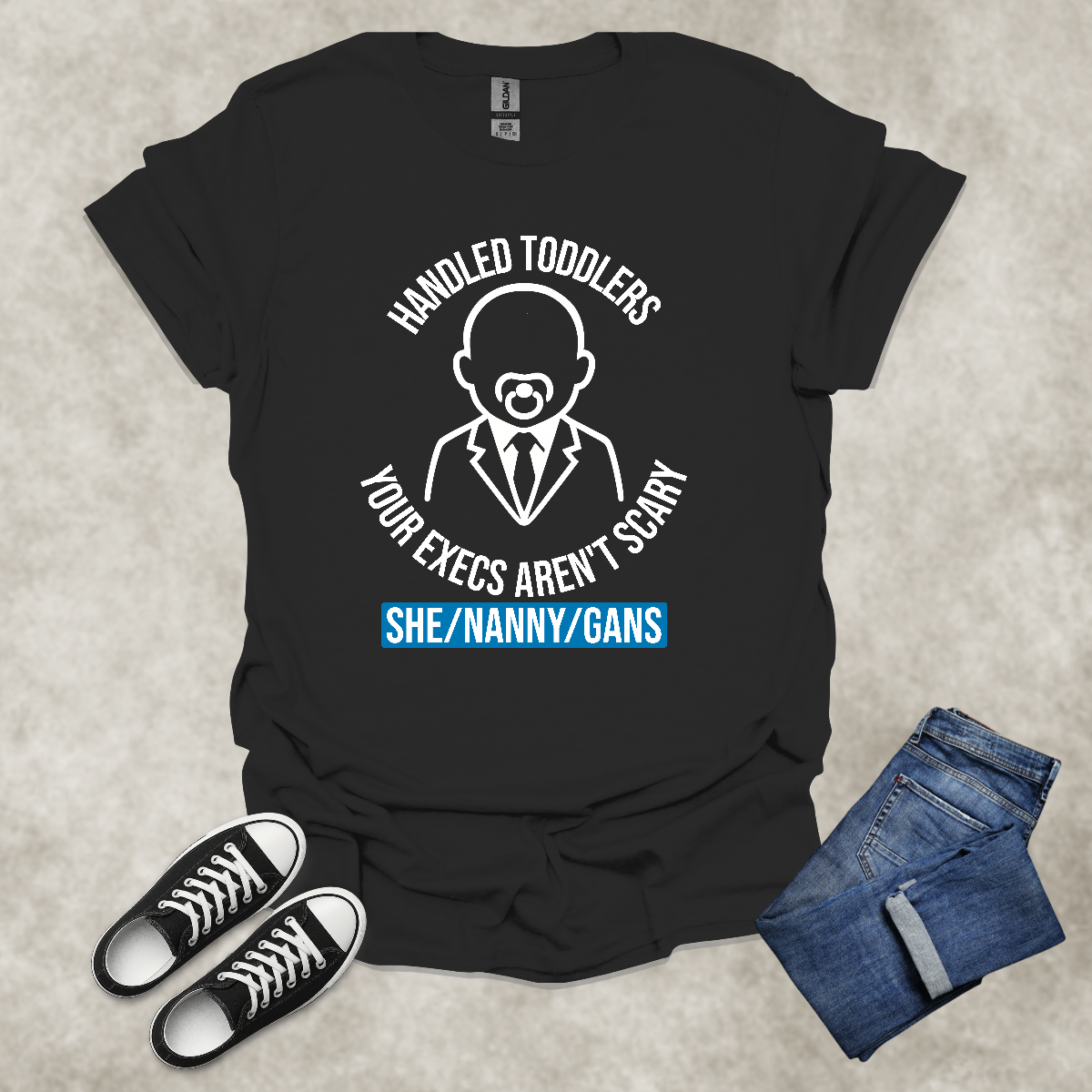 HANDLED TODDLERS: YOUR EXECS AREN'T SCARY: SHE/NANNY/GANS — Corporate Satire Tee: Unisex Softstyle T-Shirt.