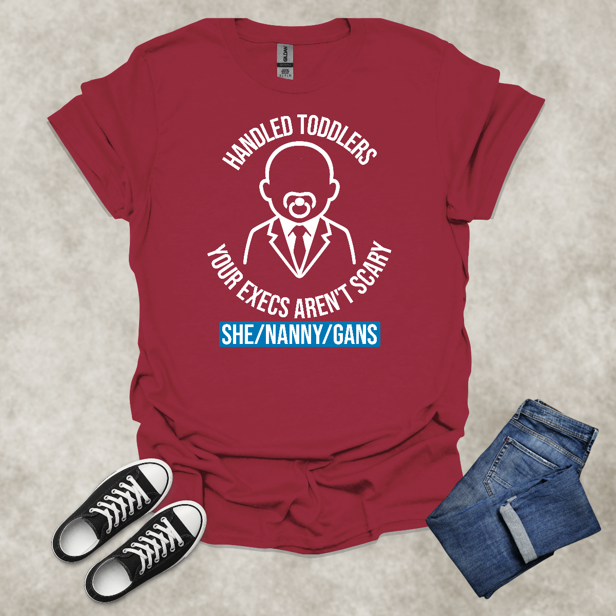 HANDLED TODDLERS: YOUR EXECS AREN'T SCARY: SHE/NANNY/GANS — Corporate Satire Tee: Unisex Softstyle T-Shirt.
