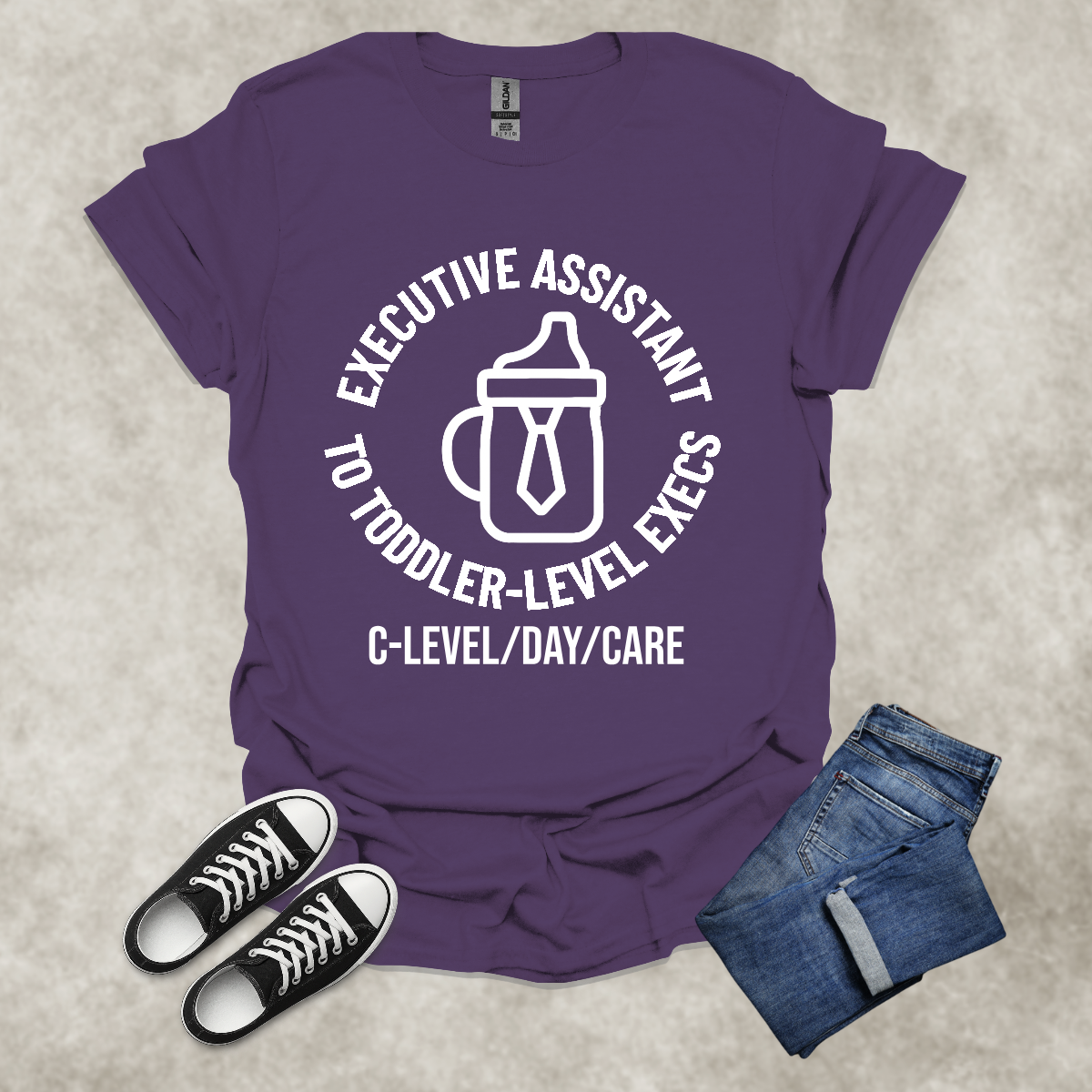 EXE ASSISTANT TO TODDLER-LEVEL EXECS: C-LEVEL/DAY/CARE — Corporate Satire Tee: Unisex Softstyle T-Shirt
