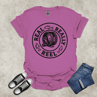 REAL: REALLY: REEL — Fishing Humor Graphic Tee: Unisex Softstyle T-Shirt