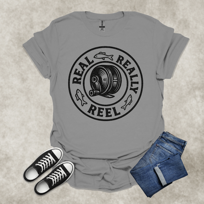 REAL: REALLY: REEL — Fishing Humor Graphic Tee: Unisex Softstyle T-Shirt