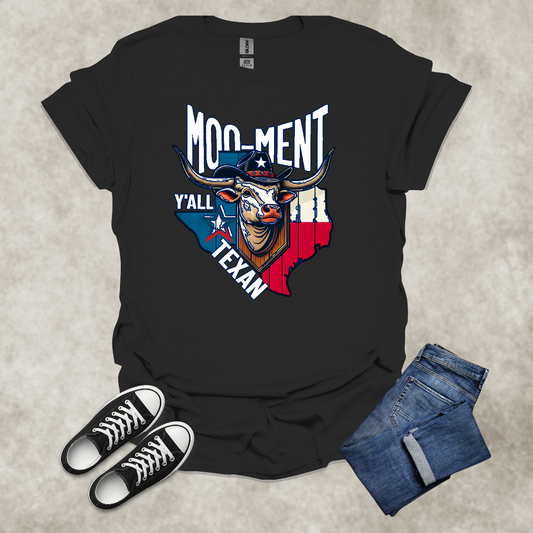 MOO-MENT Y’ALL TEXAN — Texas State Pride Humor Tee: Unisex Softstyle T-Shirt